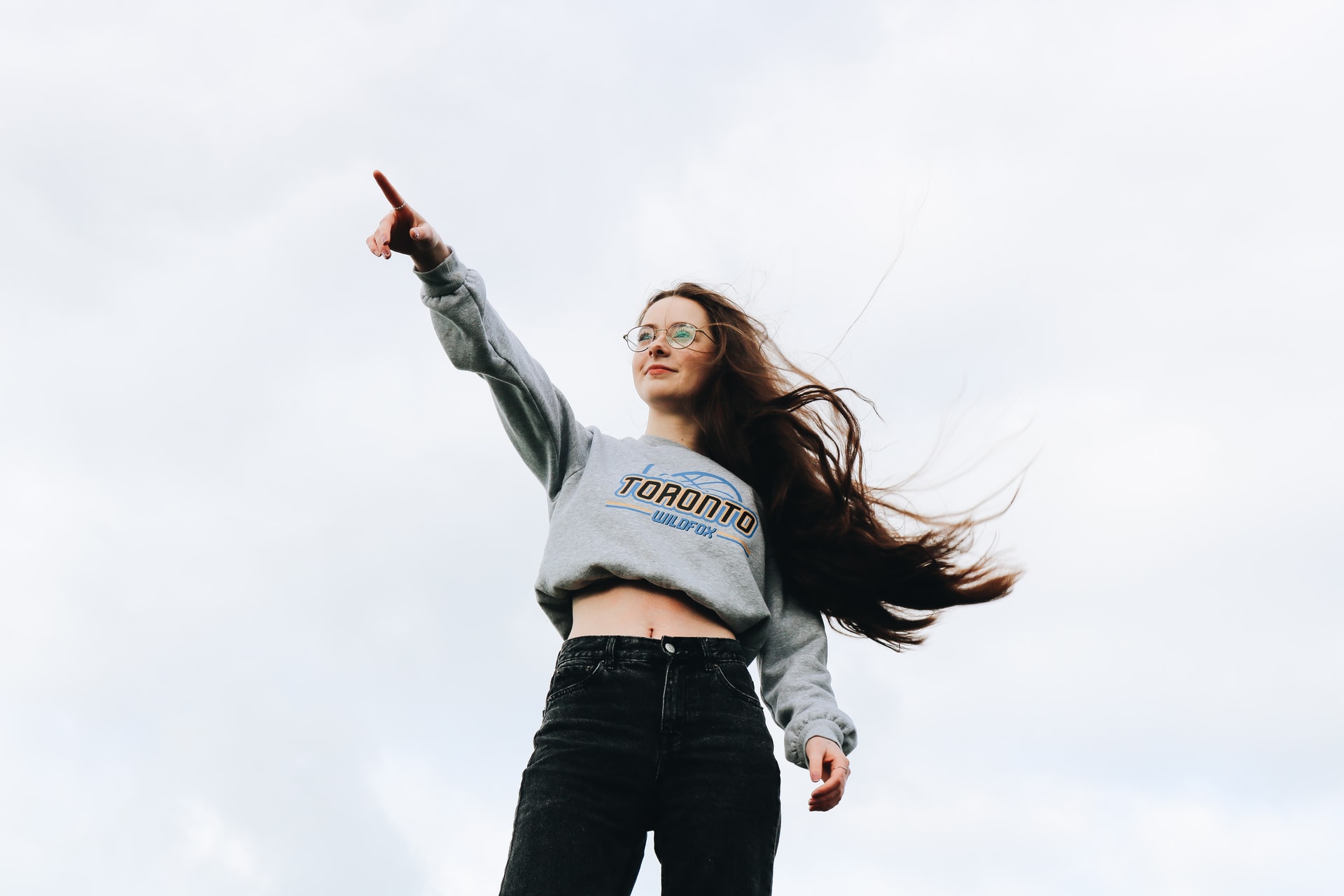 Woman pointing with her right hand